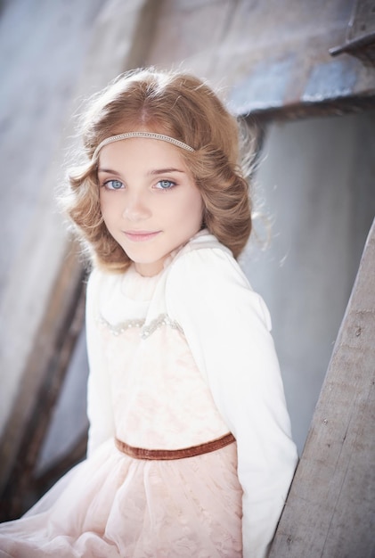 Portrait of cute blond blue eyes female teenager.