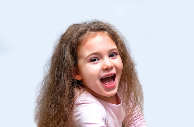 Portrait of a cute and emotional little girl, isolated on white