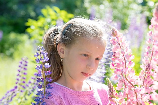 Portrait of cute girl in a field of flowers