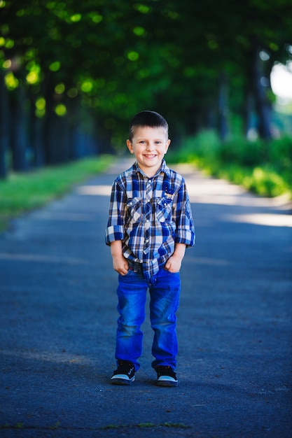 Portrait of cute little boy in a park