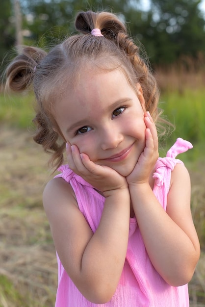 Portrait of a cute little girl outside