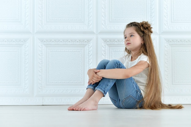 Portrait of cute little girl posing in beautiful dress