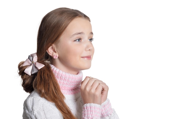 Portrait  of cute little girl praying isolated on white background