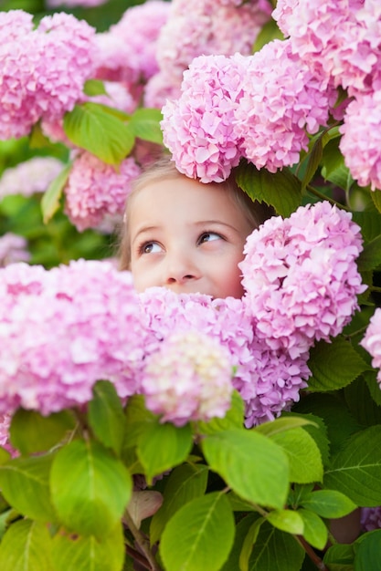 Portrait of a cute little girl wearing eyeglasses and dress.