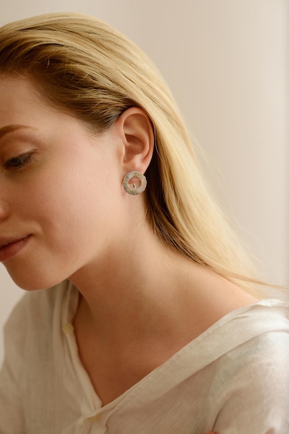 portrait of a cute woman with gold jewelry