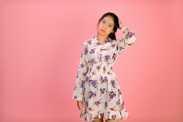 portrait of cute young asian woman wearing flower print dress