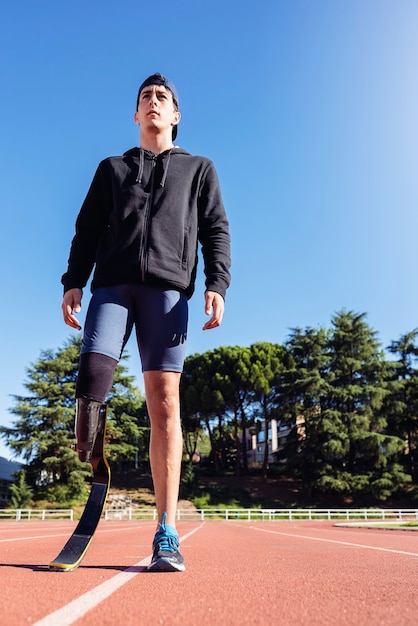 Portrait of disabled man athlete with leg prosthesis. Paralympic Sport Concept.