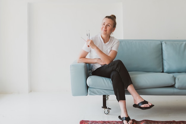 Portrait of doctor beautician  makeup master sits on a chair