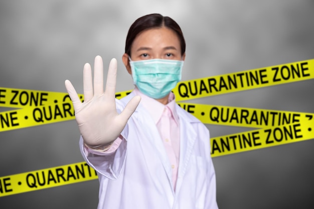 Photo portrait of doctor wearing mask showing stop sign