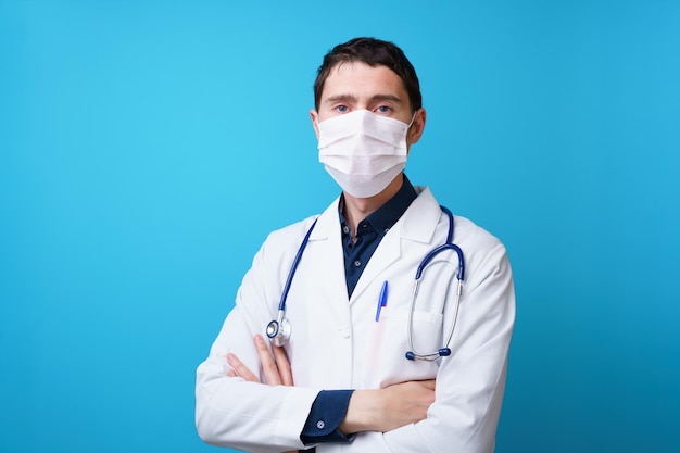 Portrait of a doctor with a stethoscope on the neck and mask on his face