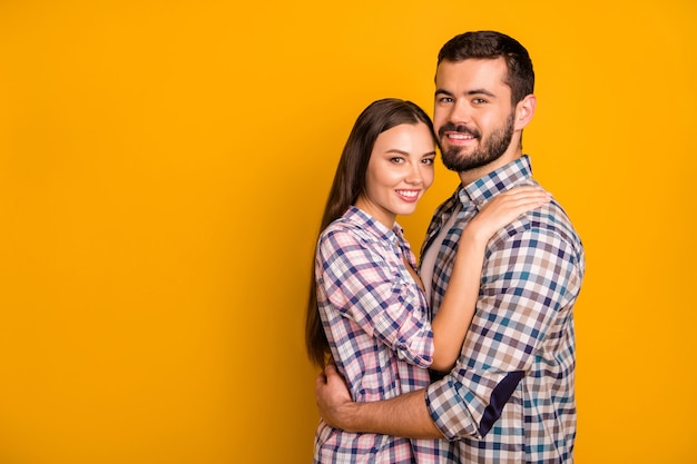 Portrait of dreamy passionate spouses hug embrace