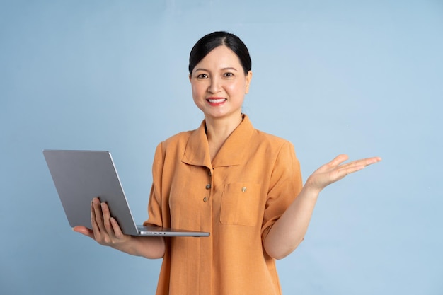 portrait of an elderly woman using a laptop