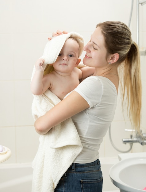 Portrait of energetic cute toddler with mother