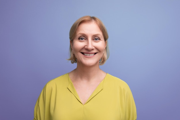 Portrait of energetic healthy middle aged blond woman with tshirt