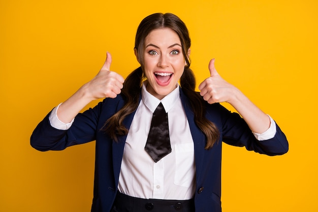 portrait of excited crazy high school student teenager enjoy show thumb up sign