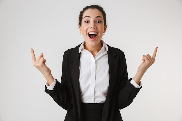 Portrait of an excited young businesswoman