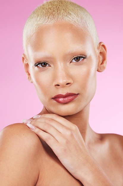 Portrait face and makeup with a model black woman in studio on a pink background for edgy cosmetics Beauty skincare or natural with a unique and attractve young female indoor for cosmetic care