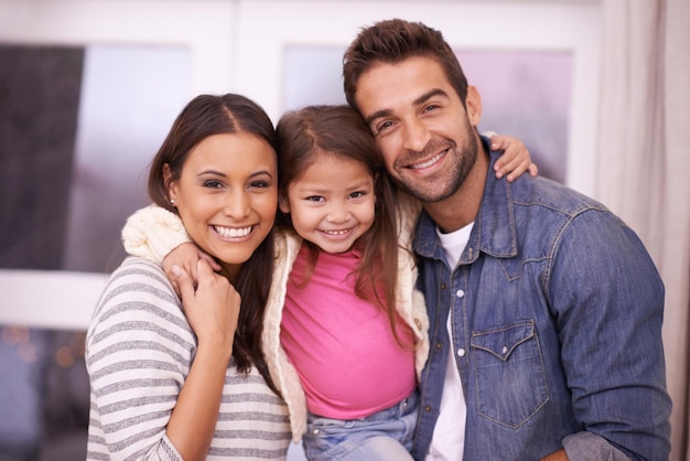 Portrait family or smile in home real estate or mortgage as bonding together outside new property Papa mama or girl child to relax love or happiness with affection in house as caring homeowner