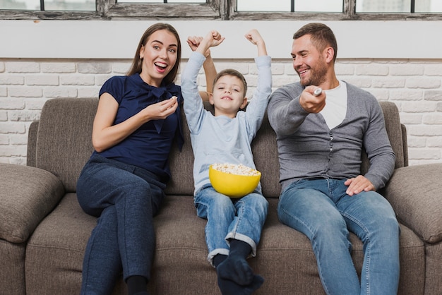 Portrait of family watching a movie