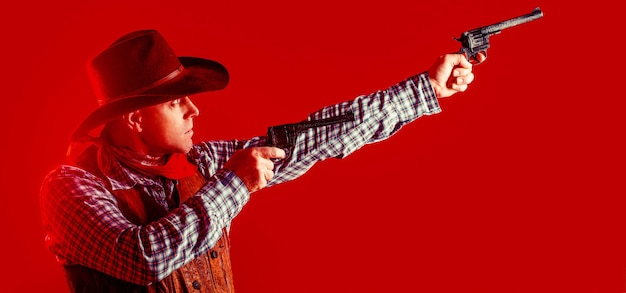 Portrait of farmer or cowboy in hat Portrait of man wearing cowboy hat gun Portrait of a cowboy West guns Portrait of a cowboy