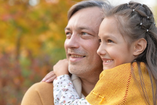 Portrait of father and cute daughter having fun outdoors