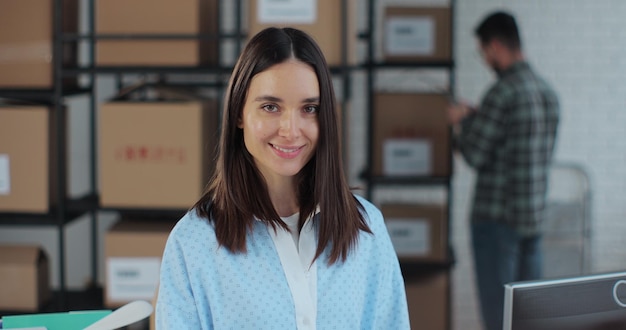 Portrait of a female business owner at work in a warehouse The sales manager works in an online store