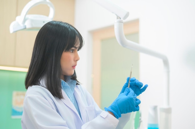 A portrait of female dentist working in dental clinic teeth checkup and Healthy teeth concept