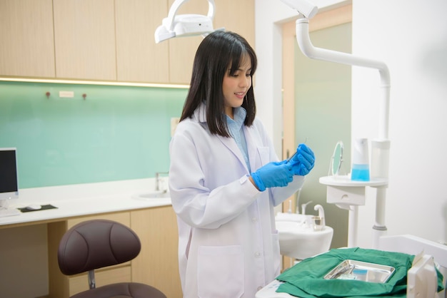 A portrait of female dentist working in dental clinic teeth checkup and Healthy teeth concept