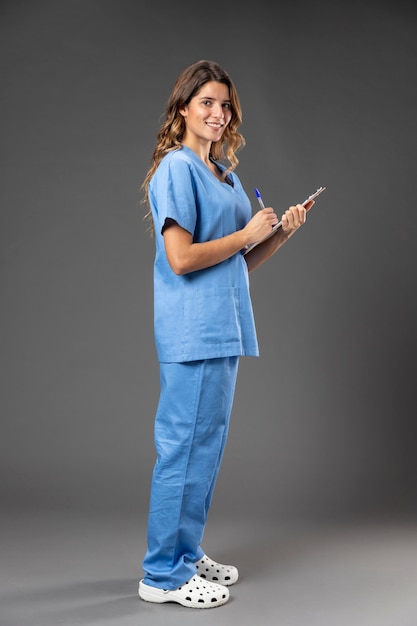 Portrait female nurse with clipboard