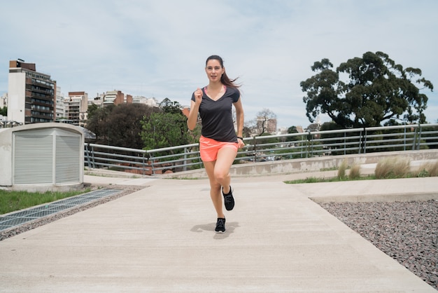 Portrait of fitness woman running.