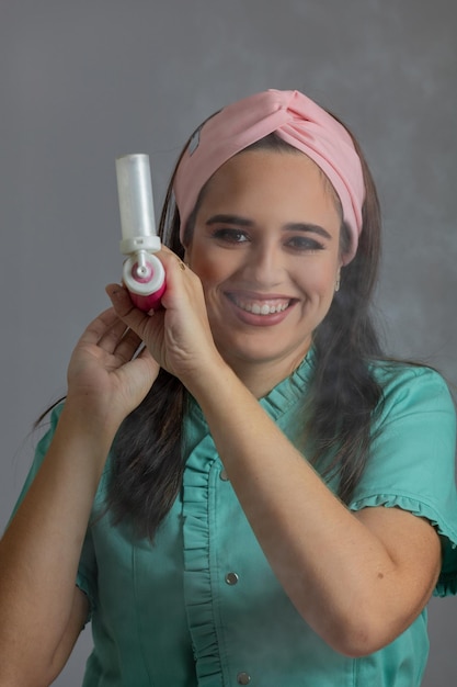 Portrait of friendly smiling professional confectioner on an isolated background