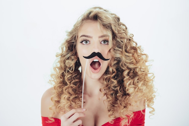 Portrait of funny curly hair girl with moustache on stick woman with curly hair makeup and cosmetics