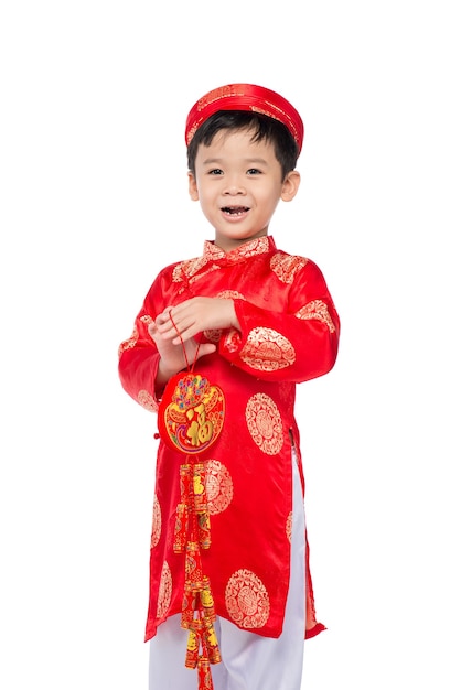 Portrait of a funny and exciting Vietnamese boy with firecrackers. Asian Kid Celebrating New Year. Text mean Happiness.