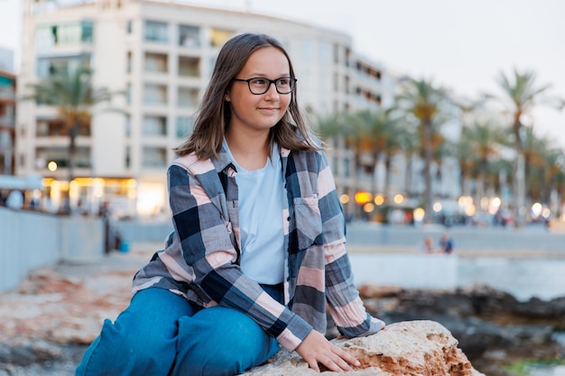 Portrait of a girl on the background of the evening city