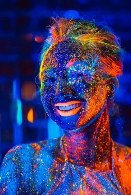 Portrait of a girl painted in fluorescent powder.