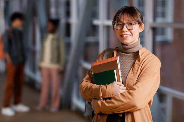 Portrait of girl student with her notebooks