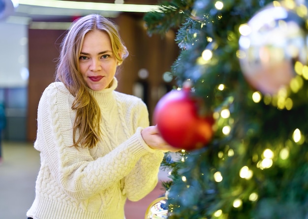 portrait of a girl in a sweater in a mall