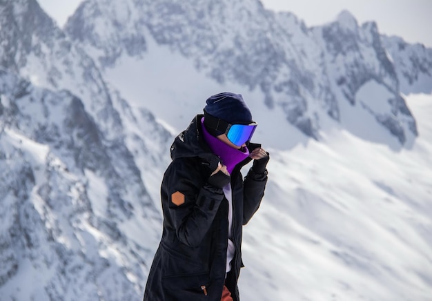 Portrait of a girl on top of a snowy mountain