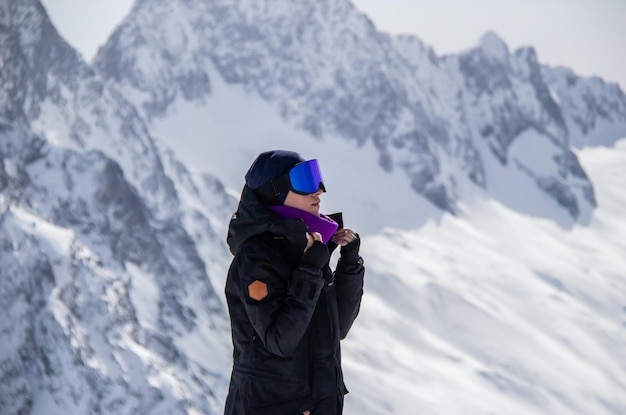 Portrait of a girl on top of a snowy mountain