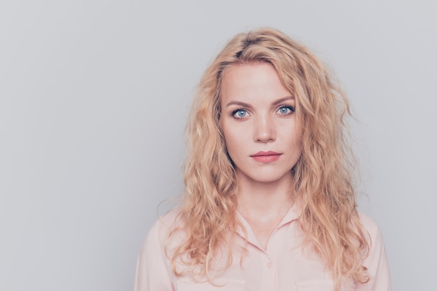 Portrait of girl wearing casual shirt isolated on grey