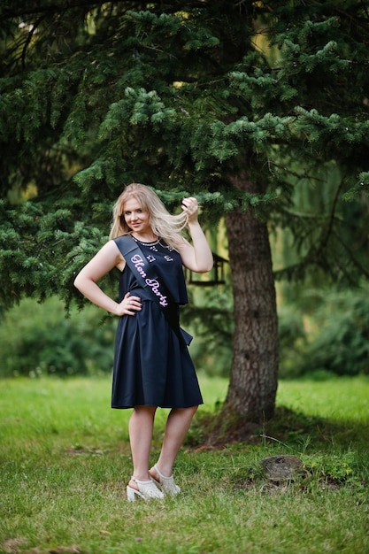 Portrait of gorgeous girl wear on black at hen party posed at park