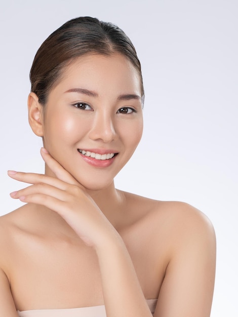 Portrait of gorgeous young girl posing beauty gesture with clean fresh skin