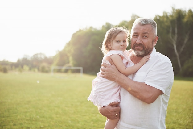 Portrait of grandfather with granddaughter