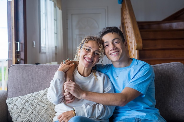 Portrait of grateful teenager man hug smiling middleaged mother show love and care thankful happy grownup son in embrace cheerful mom enjoy weekend family time at home together bonding conceptxA