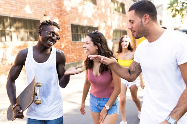 Portrait of group of active teenagers making recreational activity in an urban area.