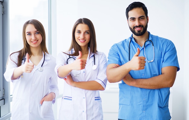 Portrait of group of smiling hospital colleagues standing together