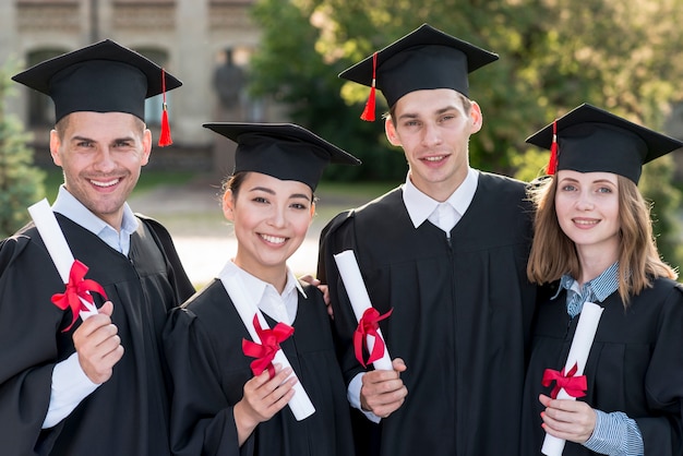 Portrait of group of students celebrating their graduation