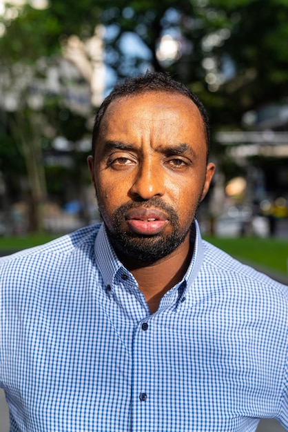 Portrait of handsome black man in city ready for business