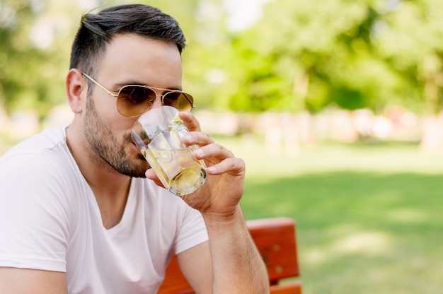 Portrait of handsome man drinking beer