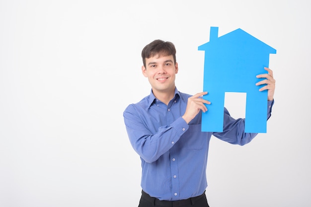 Portrait of handsome man is holding paper home on white background